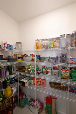 a utility room with stainless steel appliances and toys