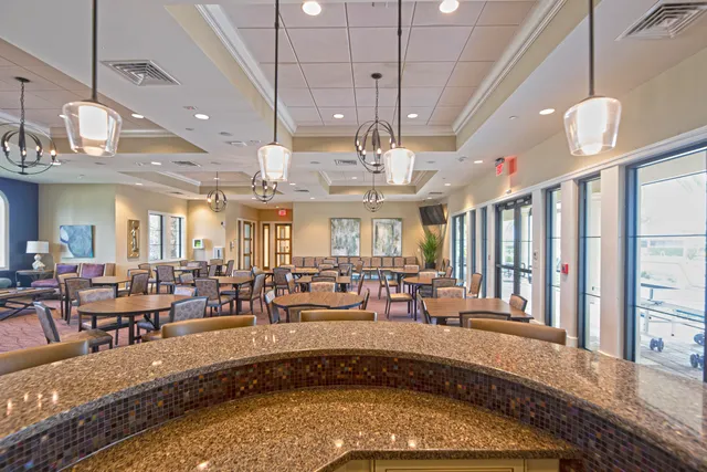 a large room with lots of tables and chairs