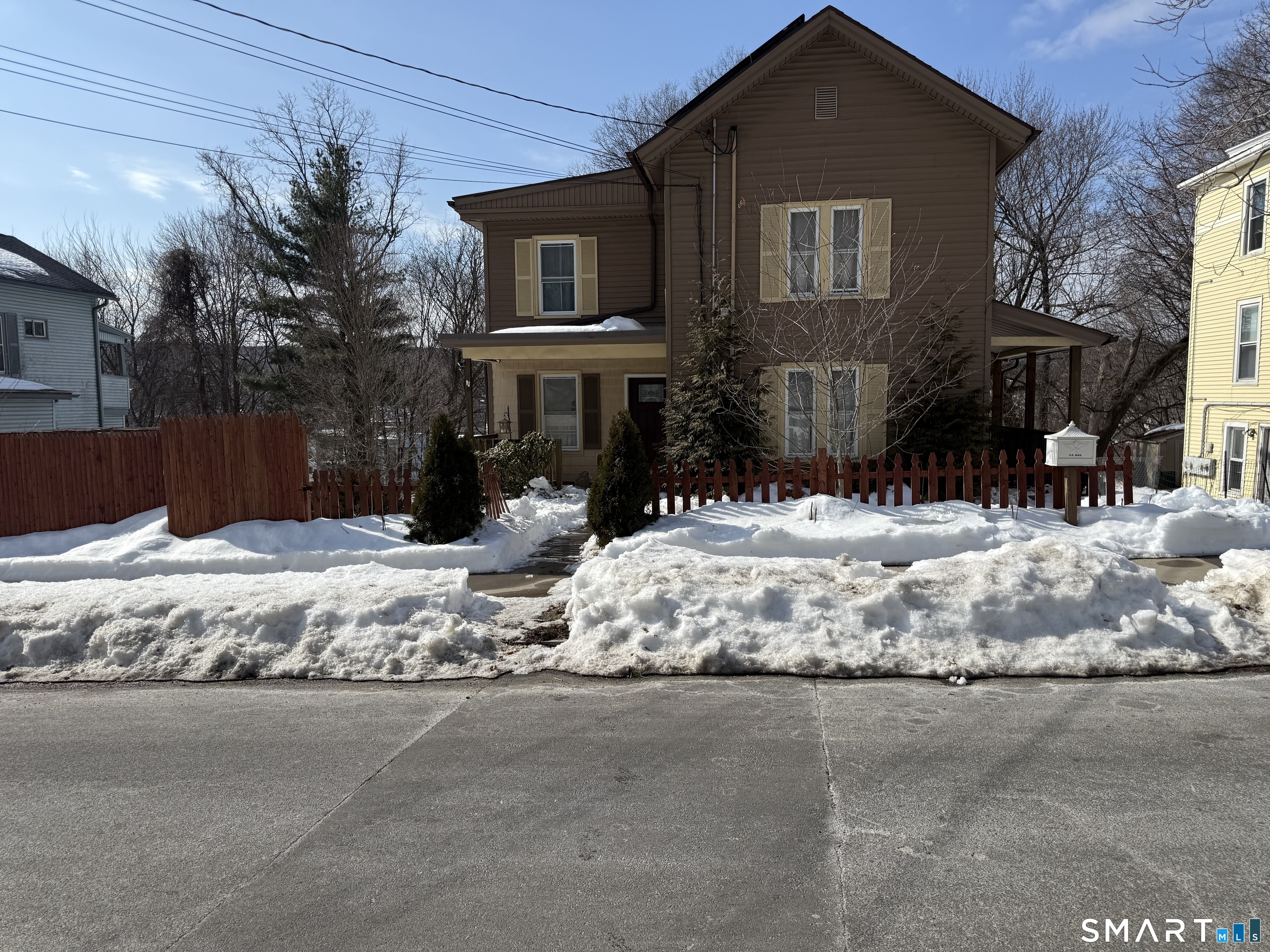 67 Summer Street Bristol, CT 06010 - Photo 1 of 31 a street view covered with snow