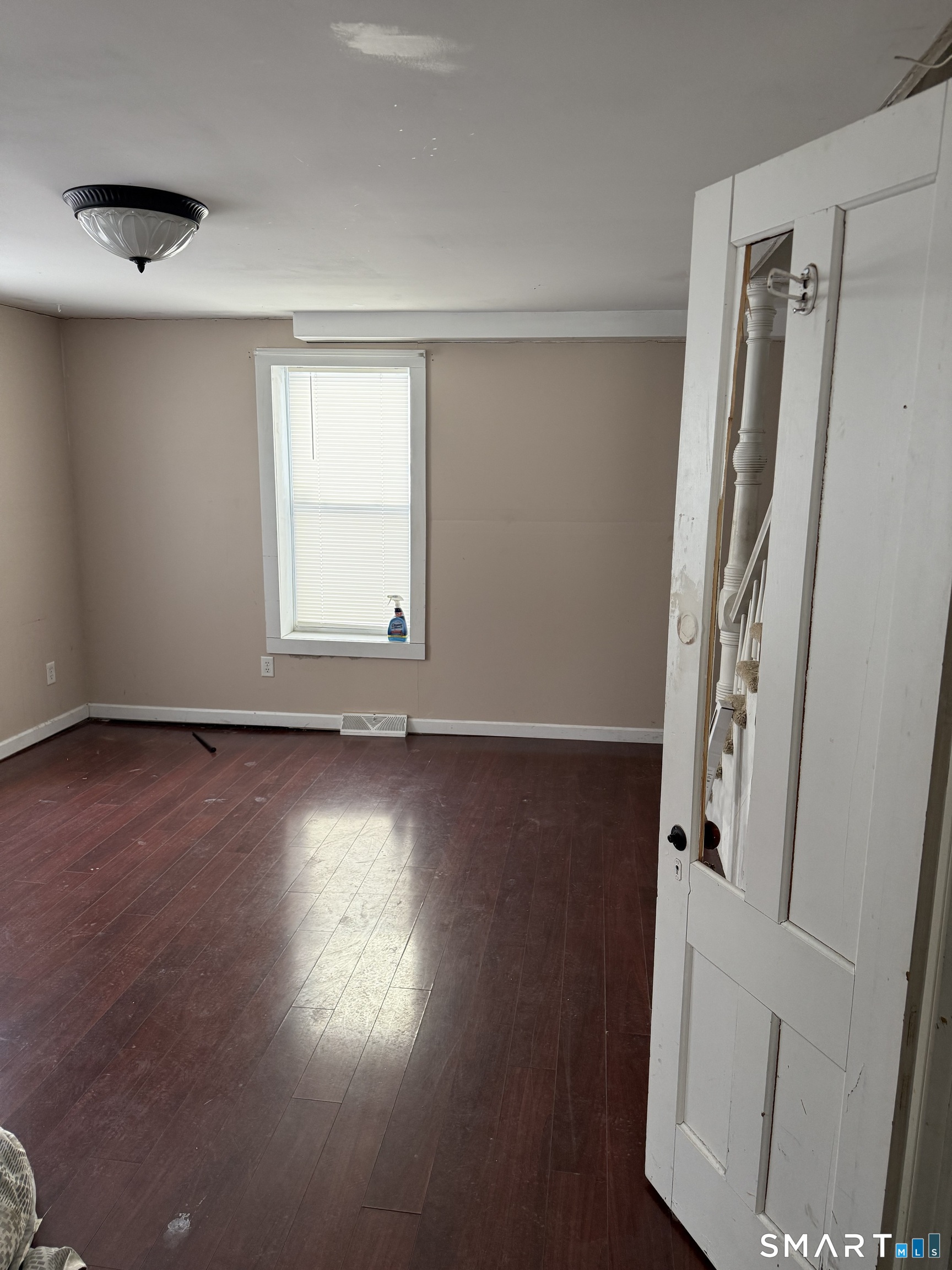 67 Summer Street Bristol, CT 06010 - Photo 15 of 31 an empty room with wooden floor and windows