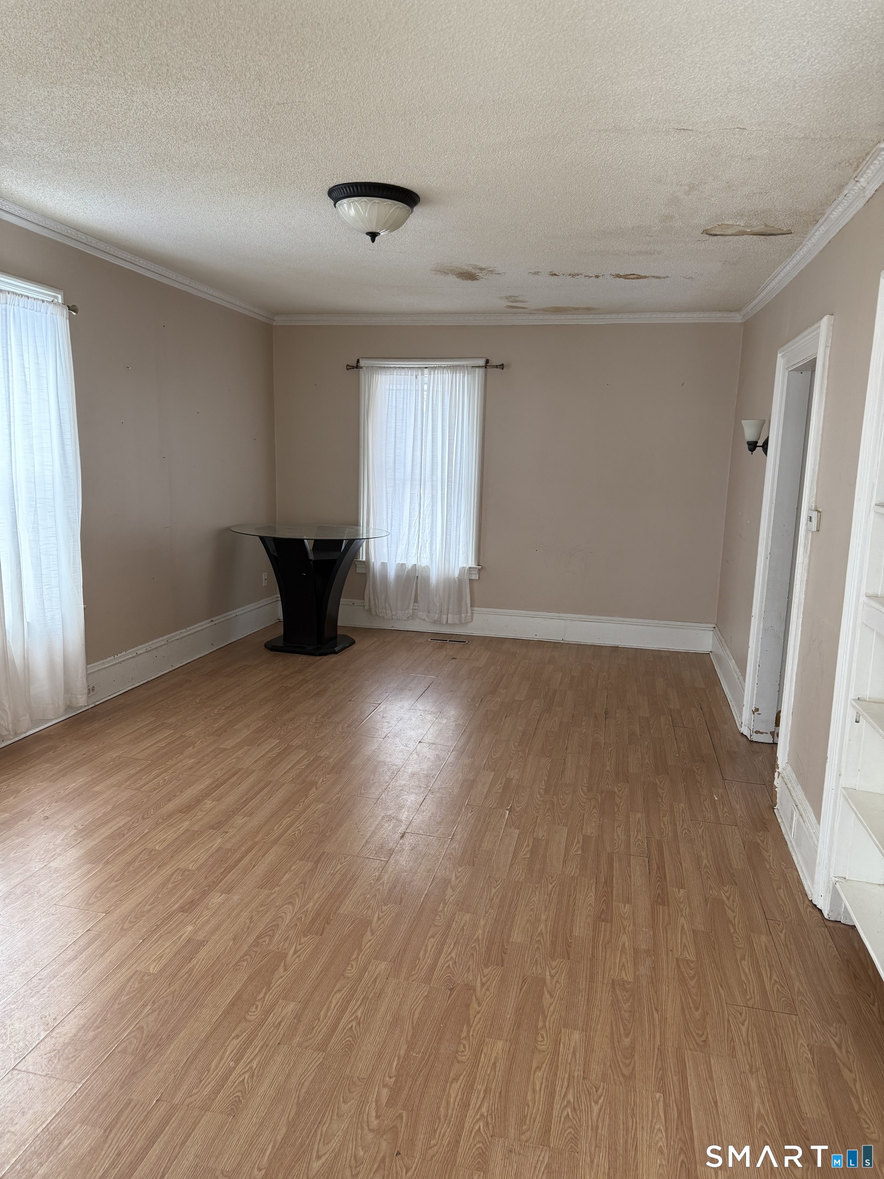 67 Summer Street Bristol, CT 06010 - Photo 20 of 31 an empty room with wooden floor and windows