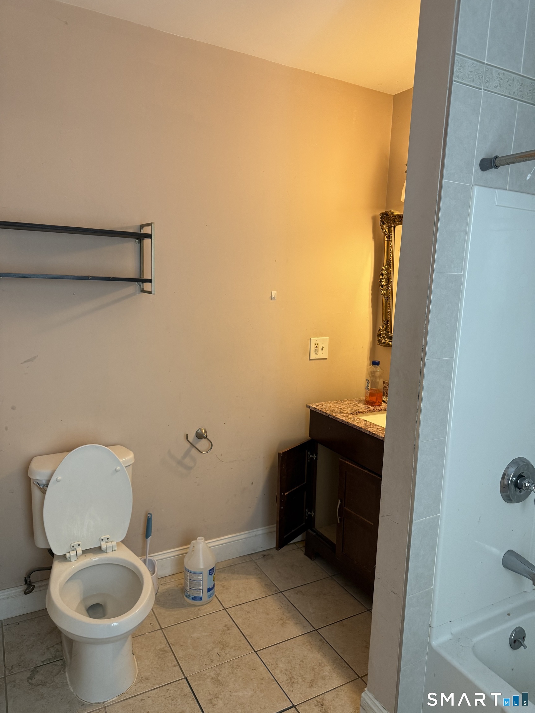 67 Summer Street Bristol, CT 06010 - Photo 27 of 31 a bathroom with a granite countertop toilet and a sink