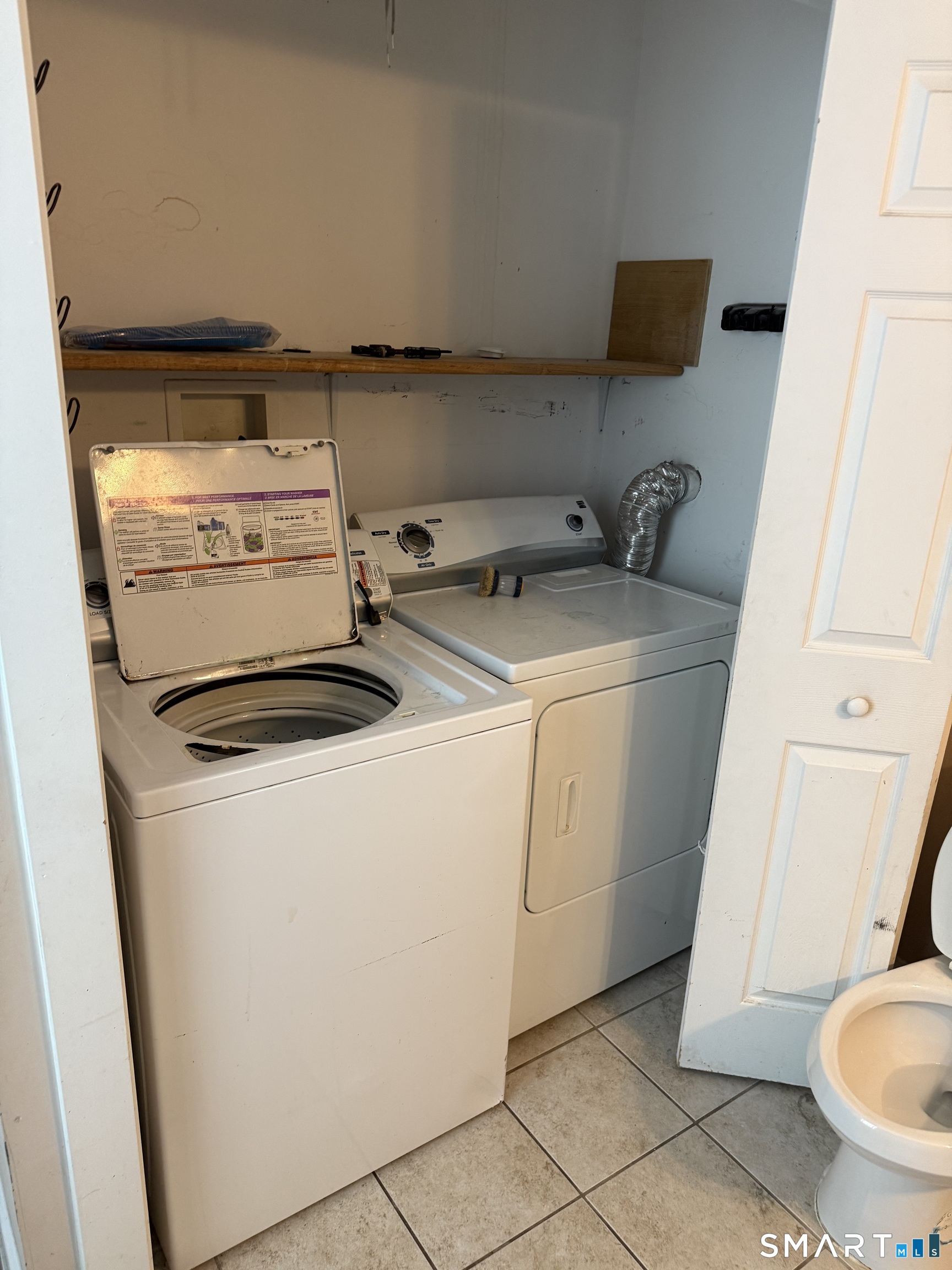 67 Summer Street Bristol, CT 06010 - Photo 28 of 31 a utility room with dryer and washer