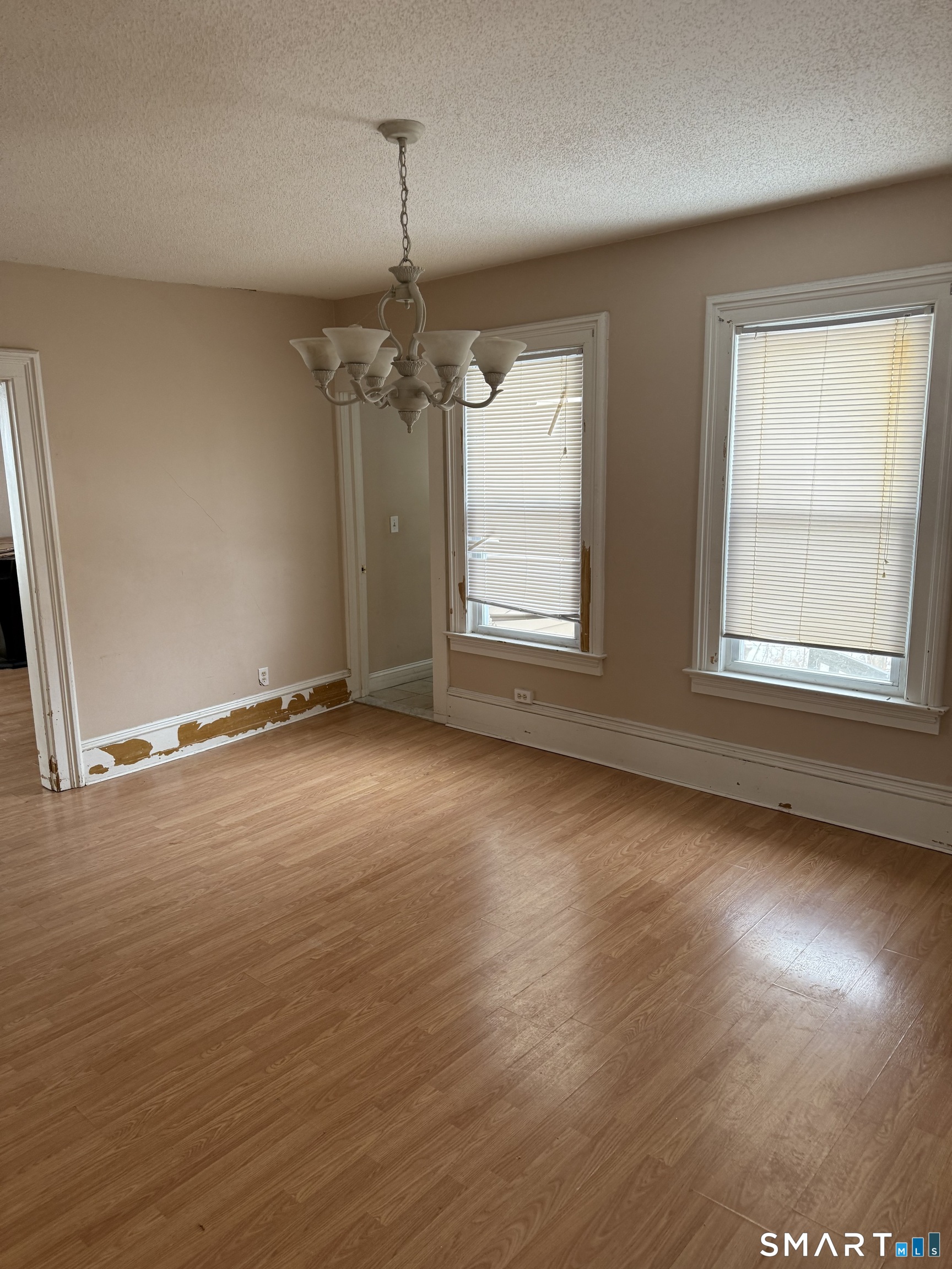 67 Summer Street Bristol, CT 06010 - Photo 29 of 31 an empty room with wooden floor and windows