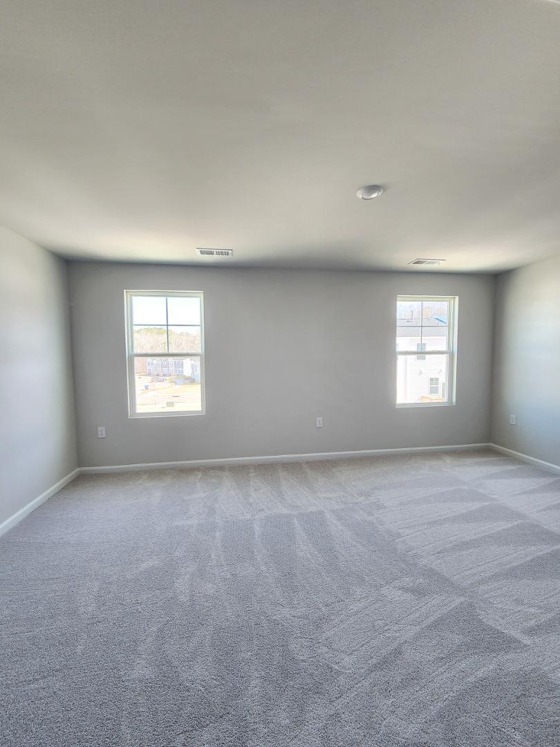 2431 Kasota Lane Raleigh, NC 27610 - Photo 33 of 59 an empty room with a window