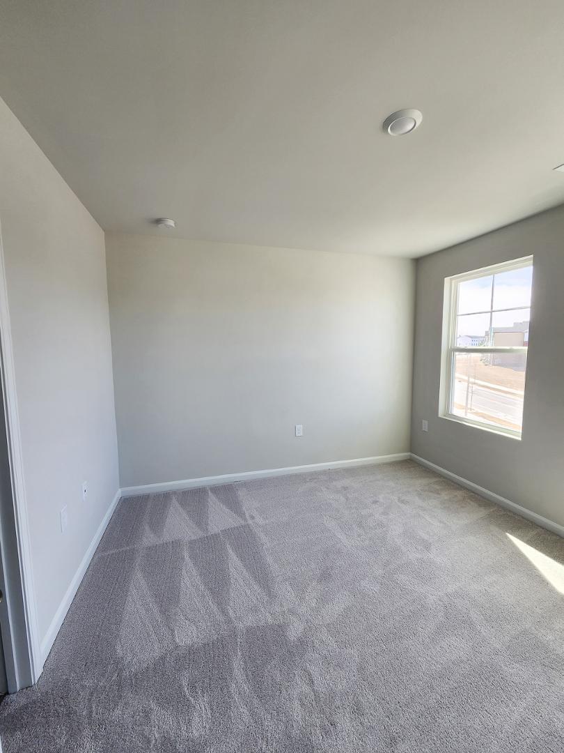 2431 Kasota Lane Raleigh, NC 27610 - Photo 43 of 59 an empty room with windows