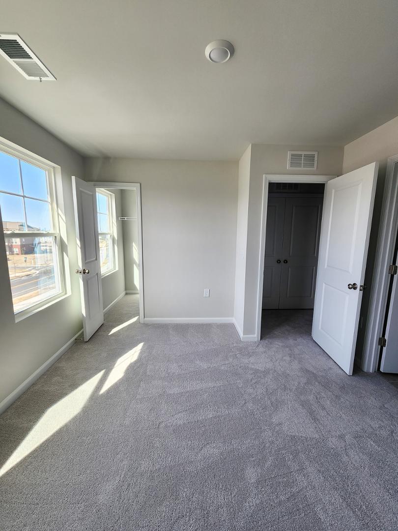 2431 Kasota Lane Raleigh, NC 27610 - Photo 47 of 59 a view of a big room with windows and closet