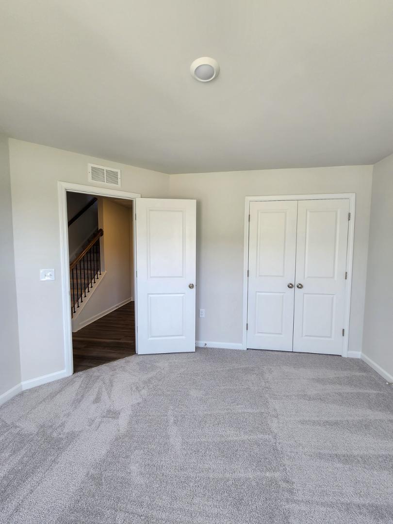 2431 Kasota Lane Raleigh, NC 27610 - Photo 6 of 59 a view of an empty room and window