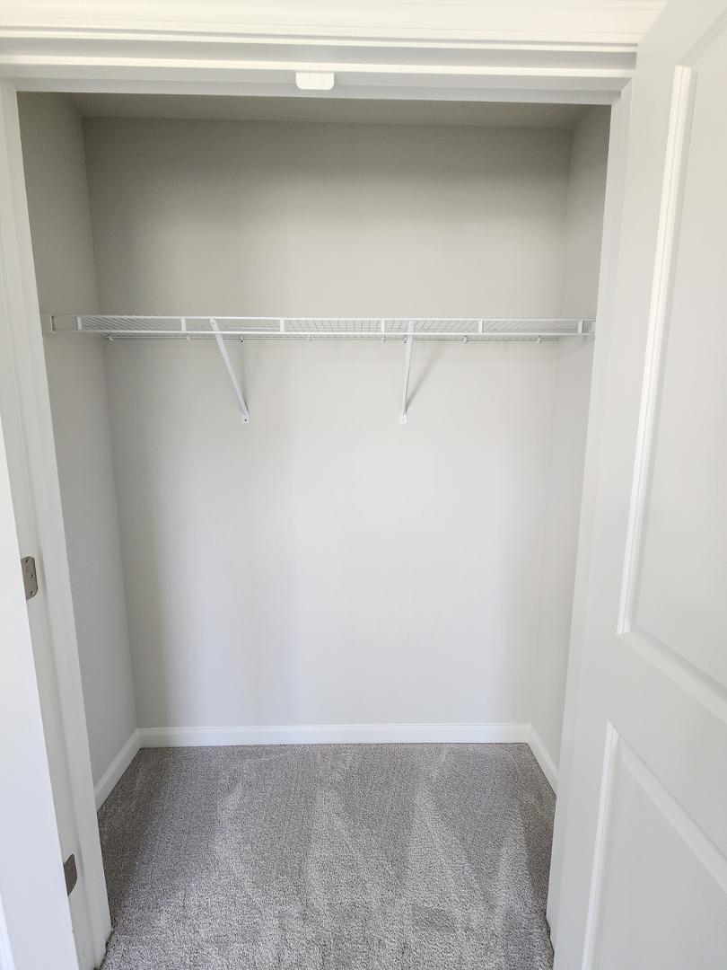 2431 Kasota Lane Raleigh, NC 27610 - Photo 9 of 59 a view of an empty walk in closet