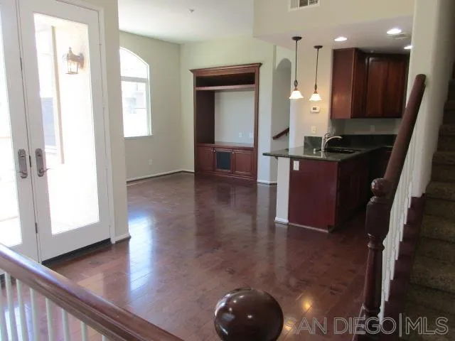 560 Almond Road San Marcos, CA 92078 - Photo 2 of 15 a view of kitchen with window and wooden floor
