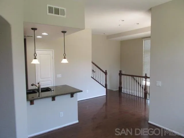 560 Almond Road San Marcos, CA 92078 - Photo 4 of 15 a view of a hallway with staircase