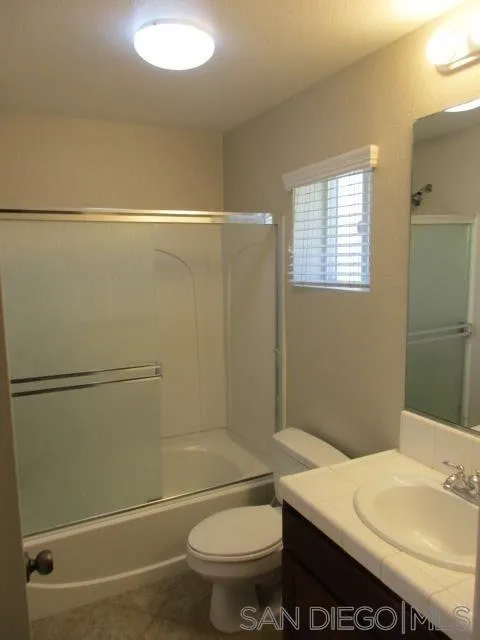 560 Almond Road San Marcos, CA 92078 - Photo 5 of 15 a bathroom with a sink a toilet and shower