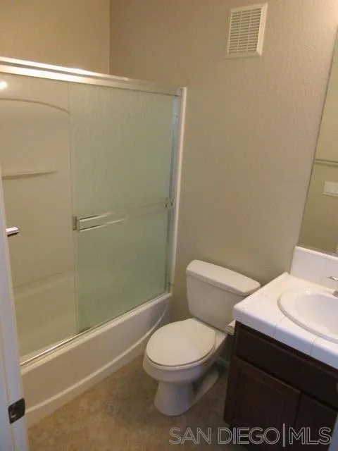 560 Almond Road San Marcos, CA 92078 - Photo 9 of 15 a white toilet sitting next to a bath tub