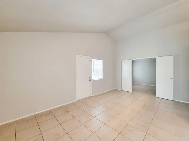 a view of an empty room and window