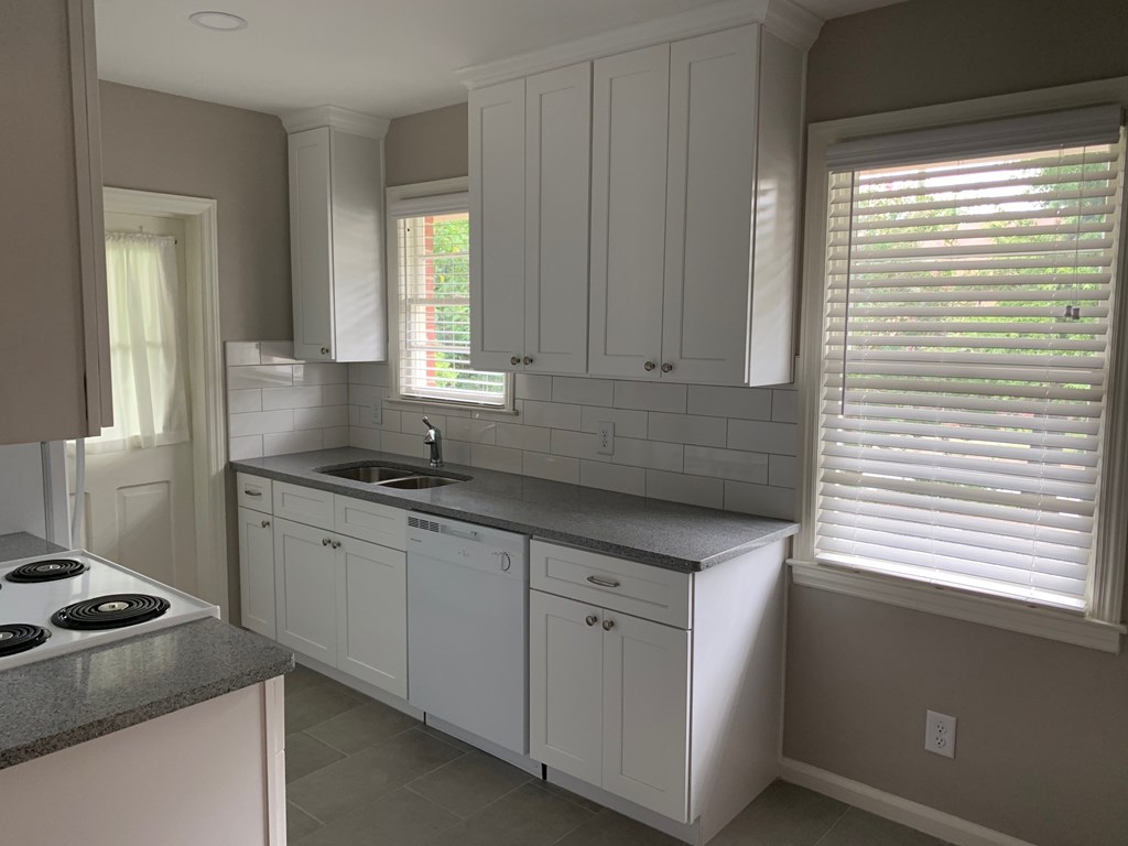1510 Wildwood Avenue, Unit 1 Columbus, GA 31906 - Photo 5 of 9 a kitchen that has a sink and a stove