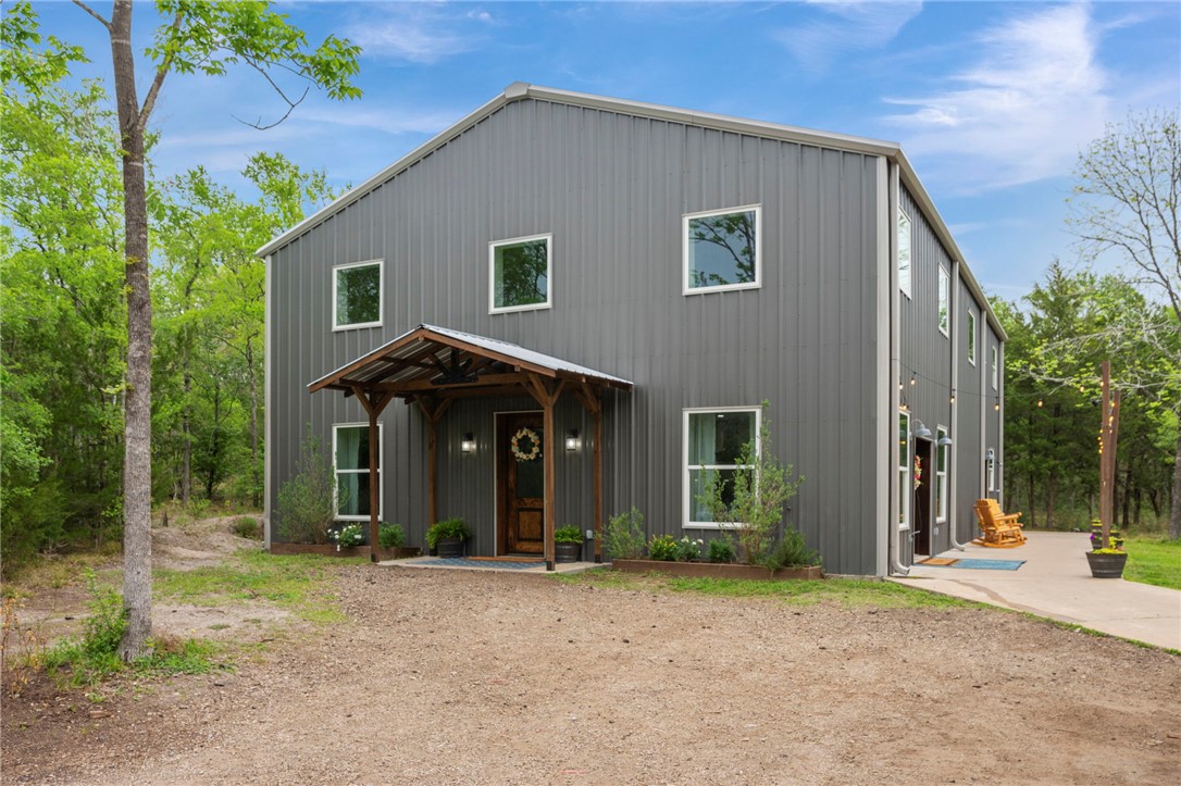 3915 County Road 447 Anderson, TX 77830 - Photo 1 of 40 a view of a house with a yard and plants