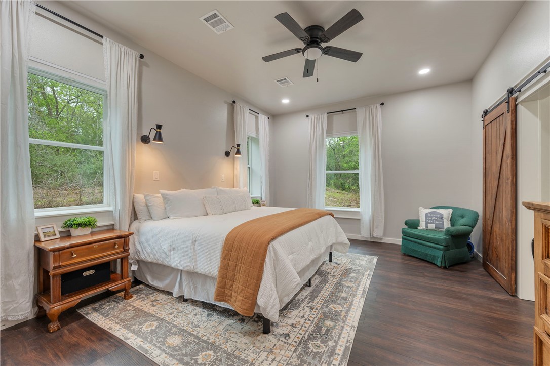 3915 County Road 447 Anderson, TX 77830 - Photo 11 of 40 a bed room with a bed and a window