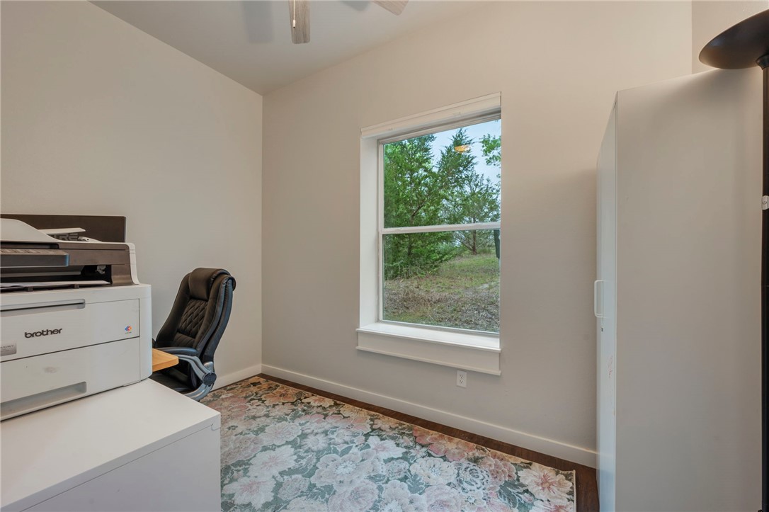 3915 County Road 447 Anderson, TX 77830 - Photo 12 of 40 a room with furniture and a window