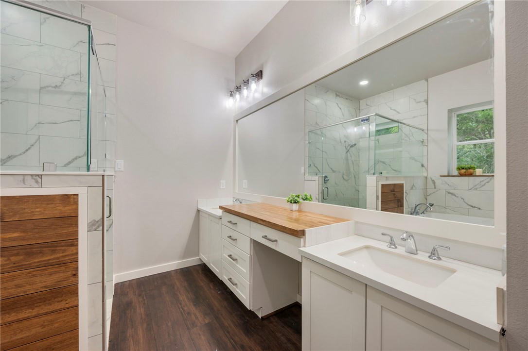 3915 County Road 447 Anderson, TX 77830 - Photo 14 of 40 a bathroom with a double vanity sink mirror and double