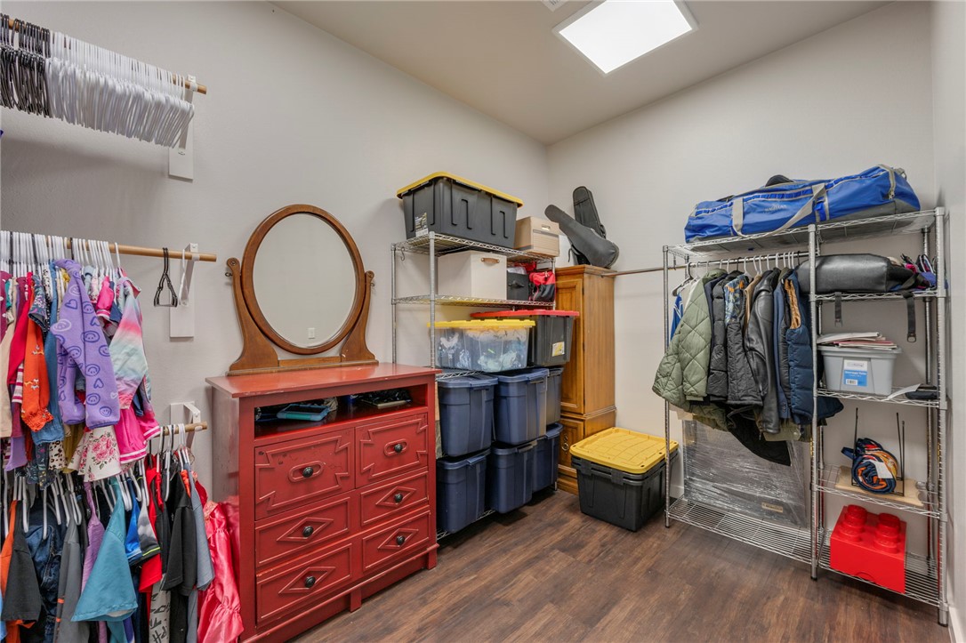 3915 County Road 447 Anderson, TX 77830 - Photo 16 of 40 a view of walk in closet with clothes and shoes