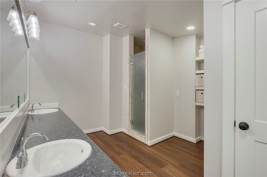 3915 County Road 447 Anderson, TX 77830 - Photo 23 of 40 a bathroom with a sink and a mirror