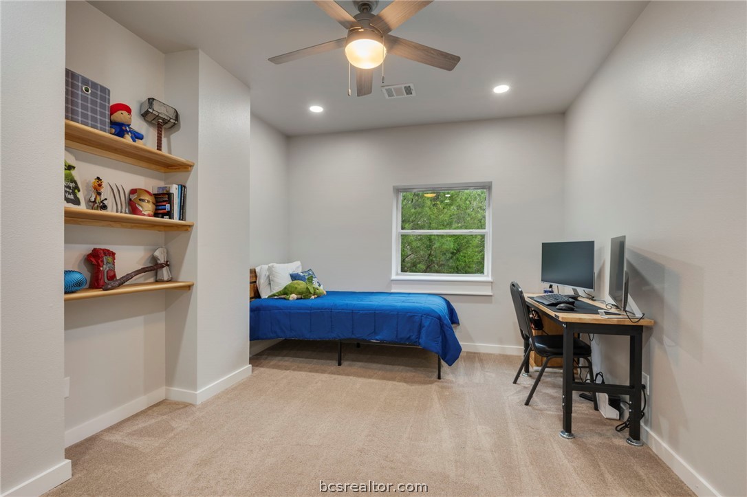3915 County Road 447 Anderson, TX 77830 - Photo 24 of 40 a bed room with a bed and a window