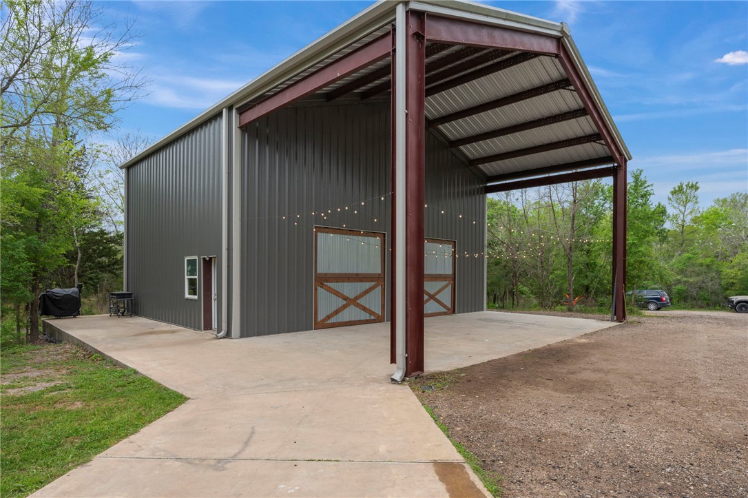3915 County Road 447 Anderson, TX 77830 - Photo 28 of 40 a view of backyard with large trees and wooden fence
