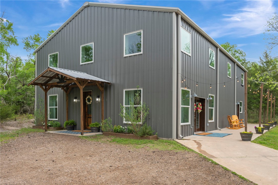 3915 County Road 447 Anderson, TX 77830 - Photo 29 of 40 a view of a house with backyard and trees