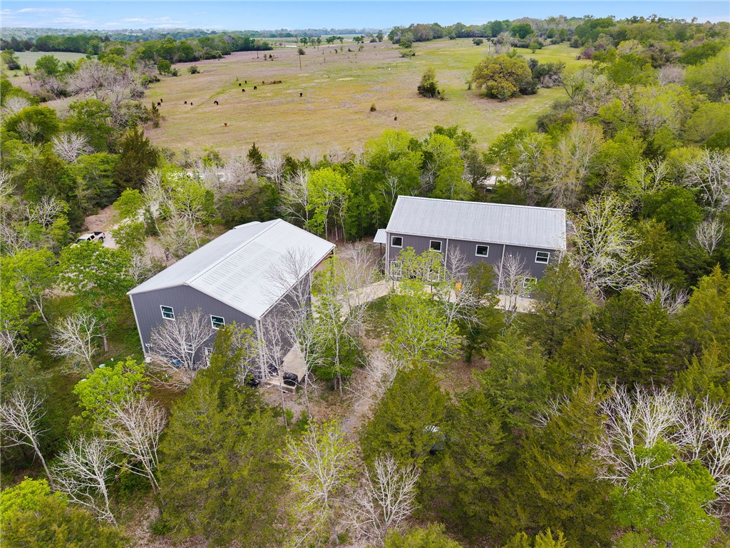 3915 County Road 447 Anderson, TX 77830 - Photo 38 of 40 a view of a lake with a house in the background