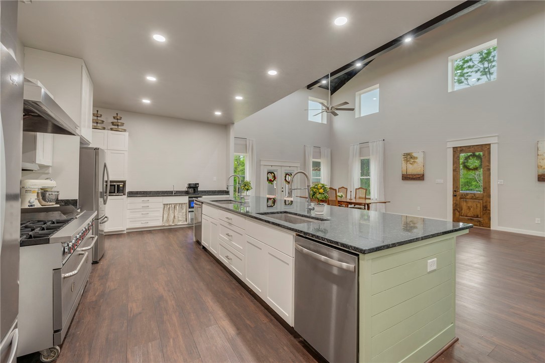 3915 County Road 447 Anderson, TX 77830 - Photo 9 of 40 a kitchen with sink stove and refrigerator