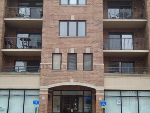 123 West St Charles Road, Unit 307 Lombard, IL 60148 - Photo 1 of 4 a front view of a building with glass windows