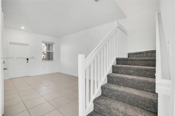 a view of an entryway with stairs