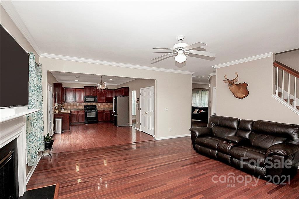 11516 Erwin Ridge Avenue Charlotte, NC 28213 - Photo 11 of 38 a living room with furniture and a fireplace
