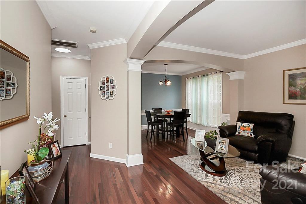 11516 Erwin Ridge Avenue Charlotte, NC 28213 - Photo 3 of 38 a living room with furniture a dining table and a potted plant