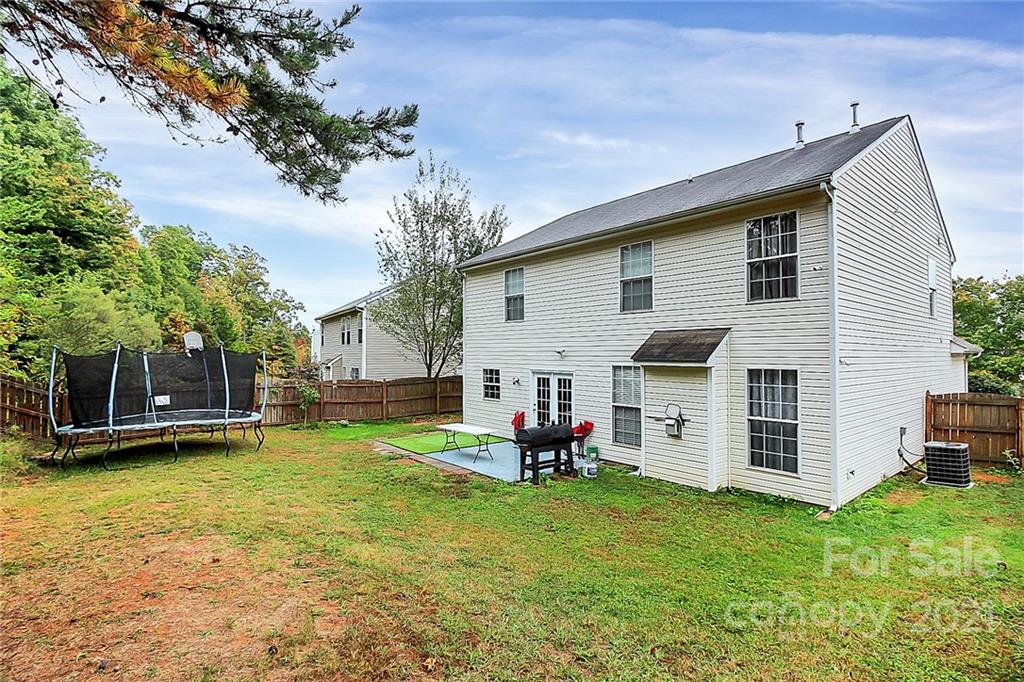 11516 Erwin Ridge Avenue Charlotte, NC 28213 - Photo 30 of 38 a view of a house with a backyard