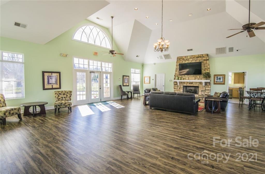 11516 Erwin Ridge Avenue Charlotte, NC 28213 - Photo 38 of 38 a living room with fireplace furniture and a flat screen tv