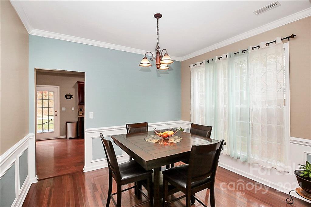 11516 Erwin Ridge Avenue Charlotte, NC 28213 - Photo 6 of 38 a view of a dining room with furniture window and wooden floor