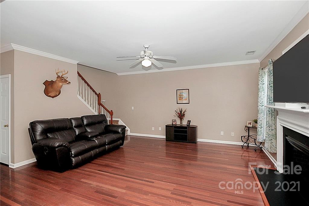 11516 Erwin Ridge Avenue Charlotte, NC 28213 - Photo 9 of 38 a living room with furniture and a flat screen tv