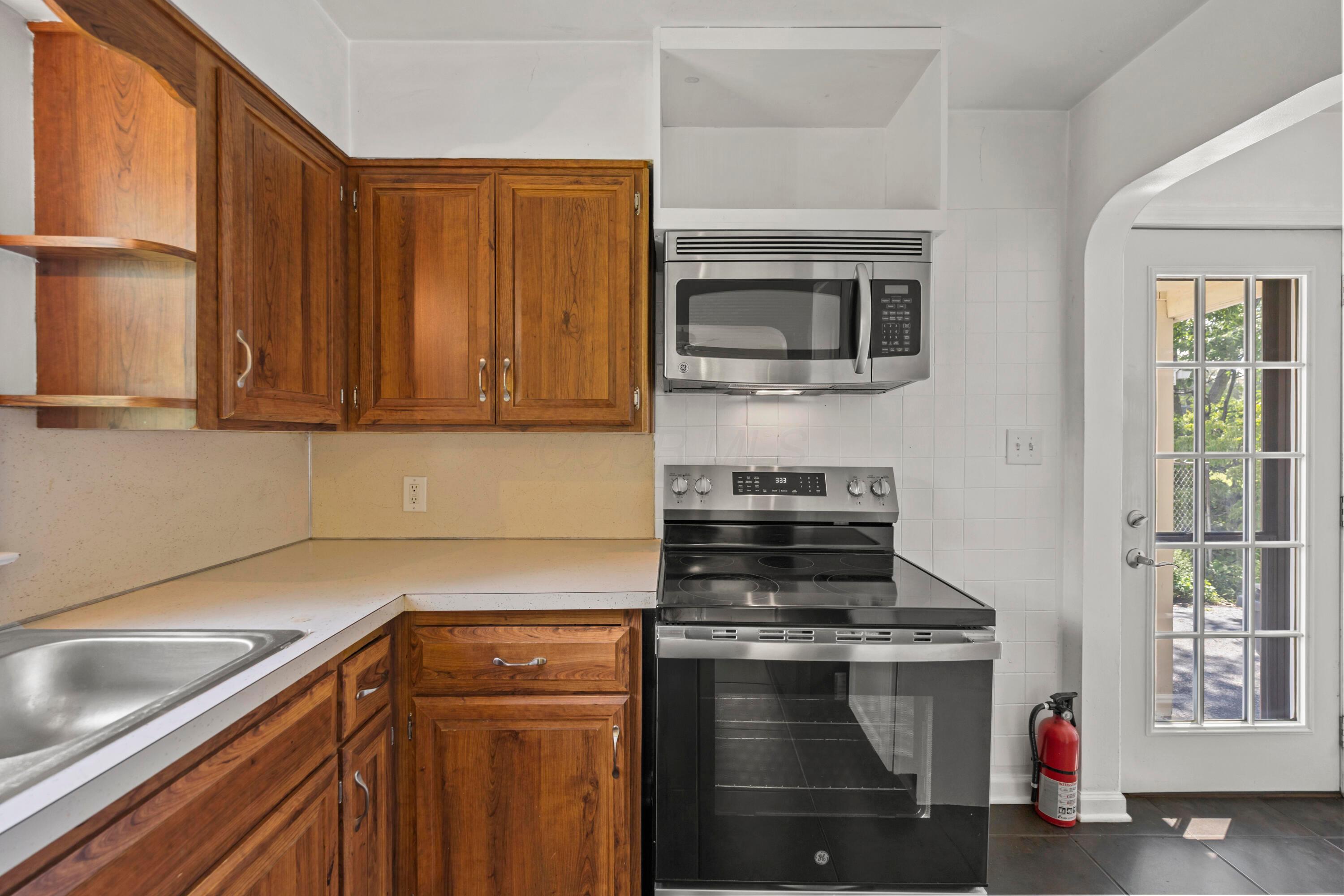 3260 Avalon Road Columbus, OH 43221 - Photo 20 of 46 kitchen featuring warm wood cabinetry