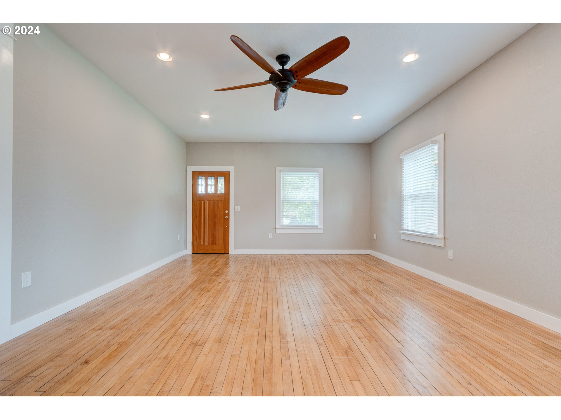 120 North 4th Avenue Ridgefield, WA 98642 - Photo 5 of 33 a view of an empty room with window and wooden floor