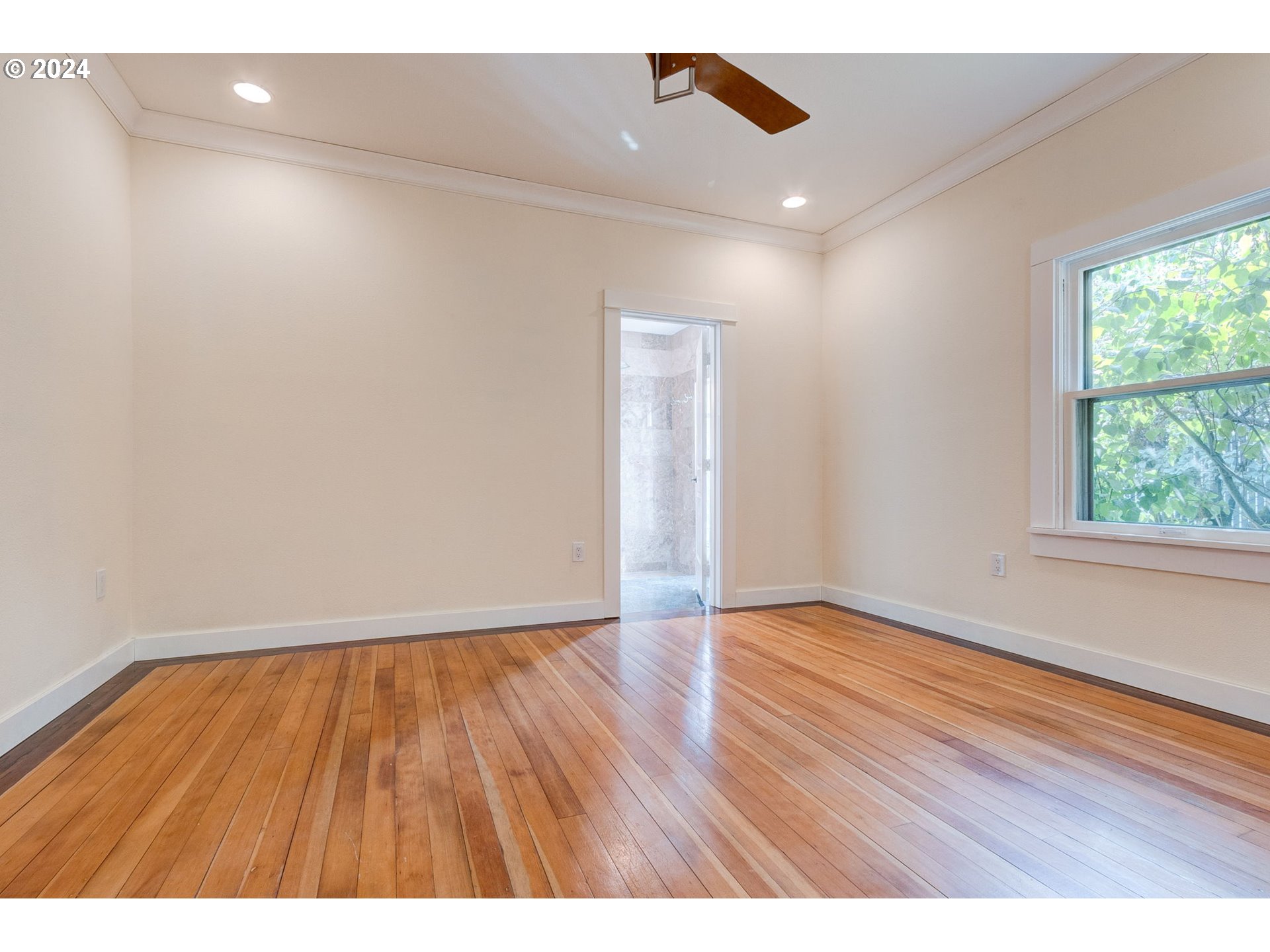 120 North 4th Avenue Ridgefield, WA 98642 - Photo 10 of 33 a view of an empty room with wooden floor and a window