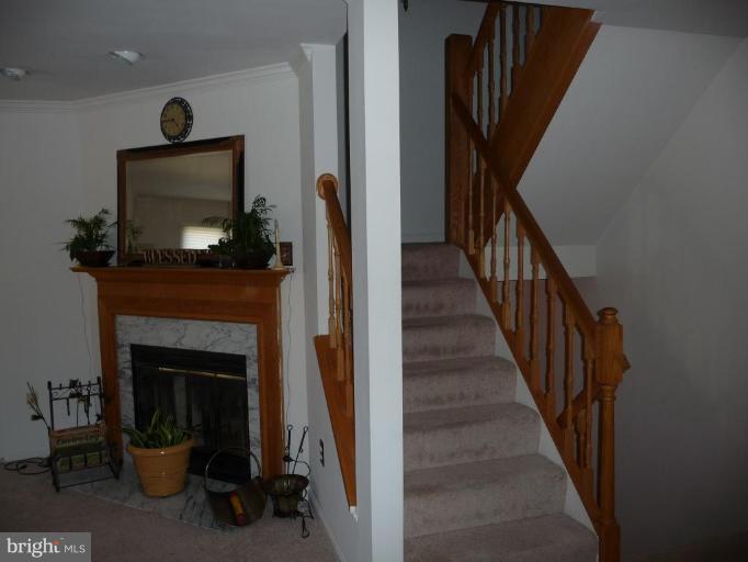 12120 Apache Tears Circle Laurel, MD 20708 - Photo 11 of 30 a view of a livingroom with furniture and a fireplace