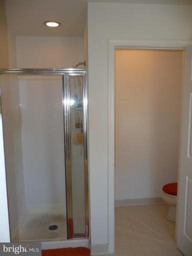 12120 Apache Tears Circle Laurel, MD 20708 - Photo 17 of 30 a bathroom with a glass shower door