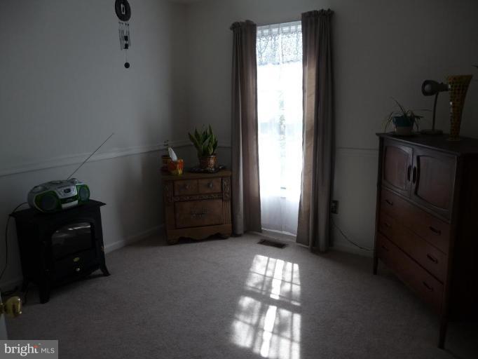 12120 Apache Tears Circle Laurel, MD 20708 - Photo 22 of 30 a room with closet and a window