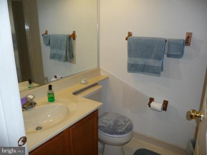 12120 Apache Tears Circle Laurel, MD 20708 - Photo 29 of 30 a bathroom with a sink toilet and mirror