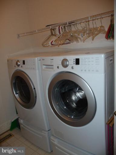 12120 Apache Tears Circle Laurel, MD 20708 - Photo 5 of 30 a utility room with dryer and washer