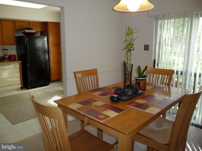 12120 Apache Tears Circle Laurel, MD 20708 - Photo 7 of 30 a view of a dining room with furniture window and outside view