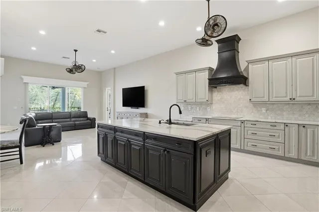 a kitchen with stainless steel appliances a stove oven and a sink