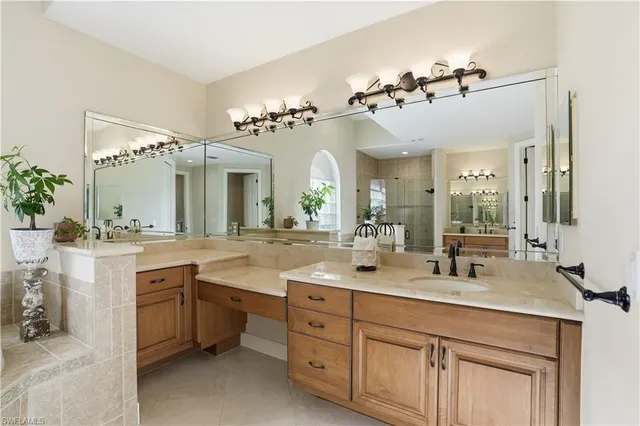 a bathroom with a double vanity sink and a mirror