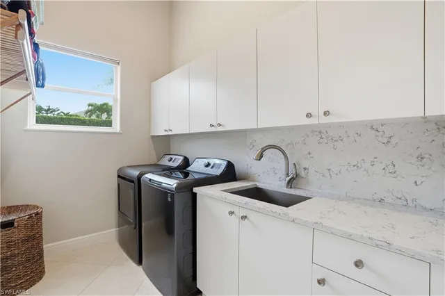 a view of storage and utility room with washer and dryer